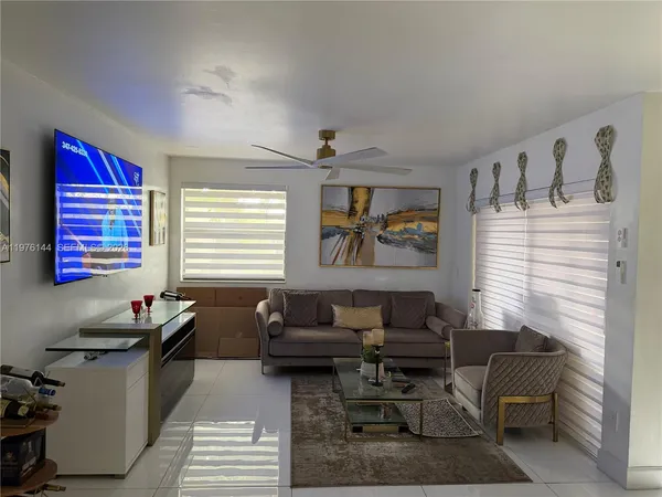 a living room with furniture and a window