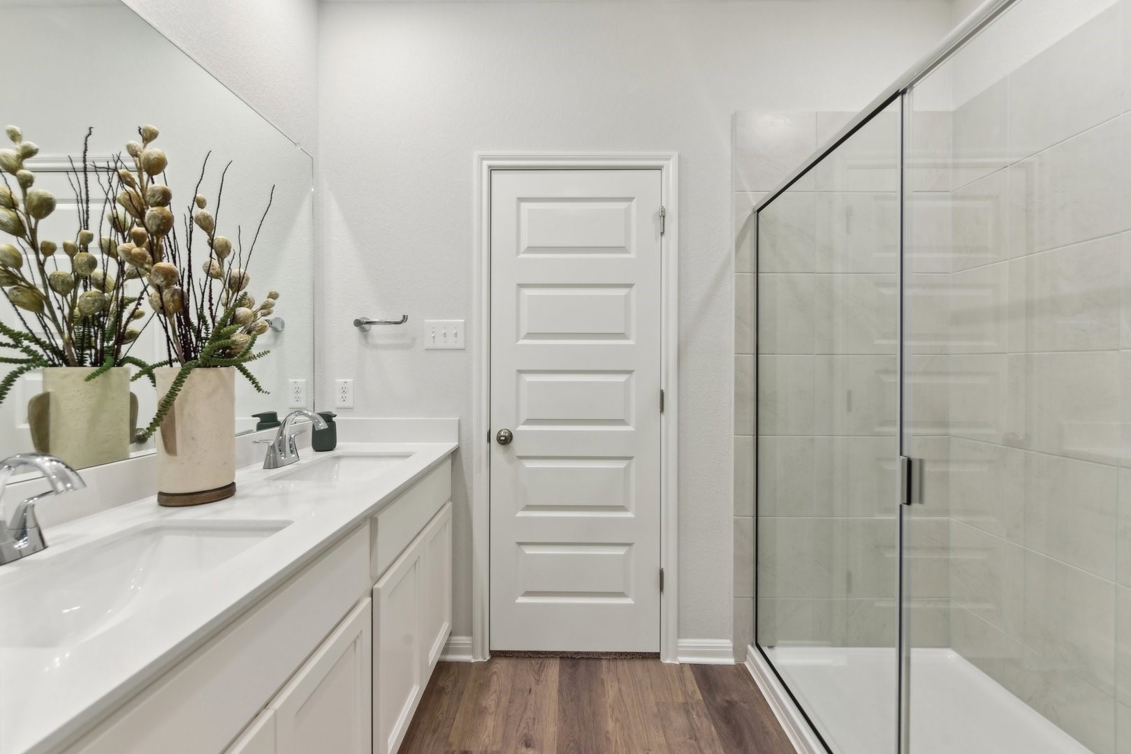 216 Firefox Way Jarrell, TX 76537 - Photo 12 of 17 A sleek double vanity and glass-enclosed shower highlight this modern bathroom.