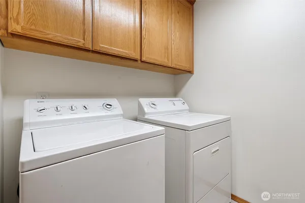 a utility room with dryer and washer