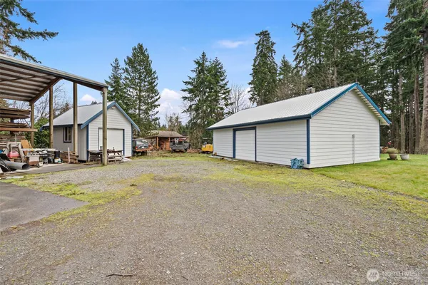 a view of a house with a yard and garage