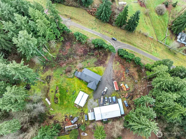 an aerial view of house with yard swimming pool and outdoor seating
