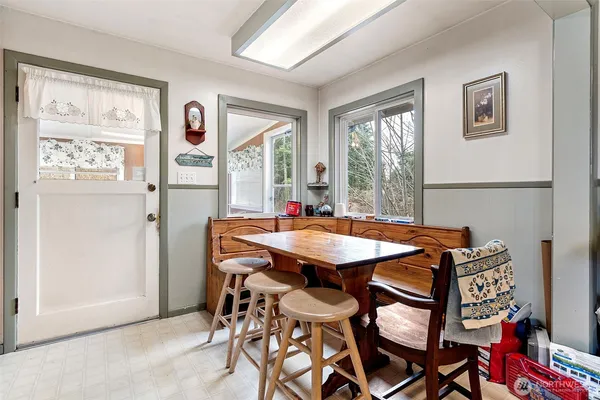 a dining room with furniture and window