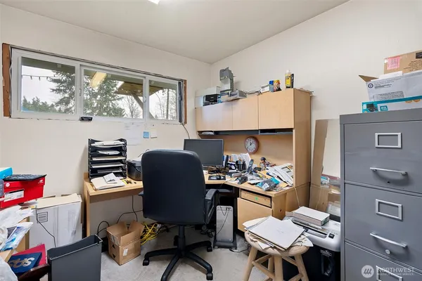 a workspace with furniture and window