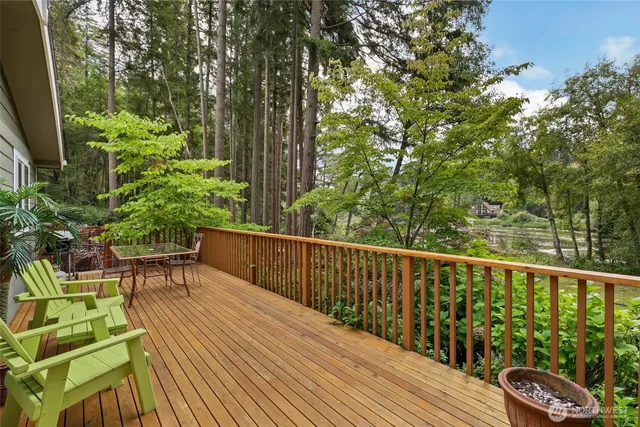 a view of balcony with wooden floor and outdoor seating