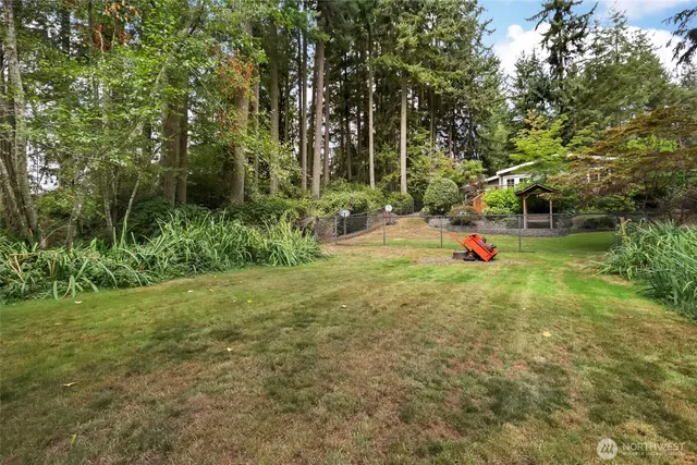 a view of a backyard with sitting area