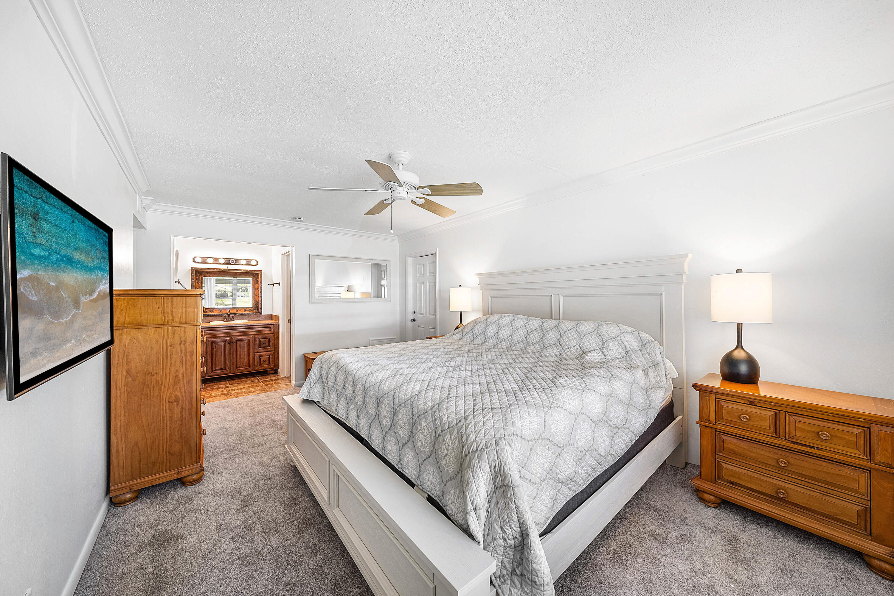 510 High Point Drive, Unit D Delray Beach, FL 33445 - Photo 11 of 23 a bedroom with a bed and a television