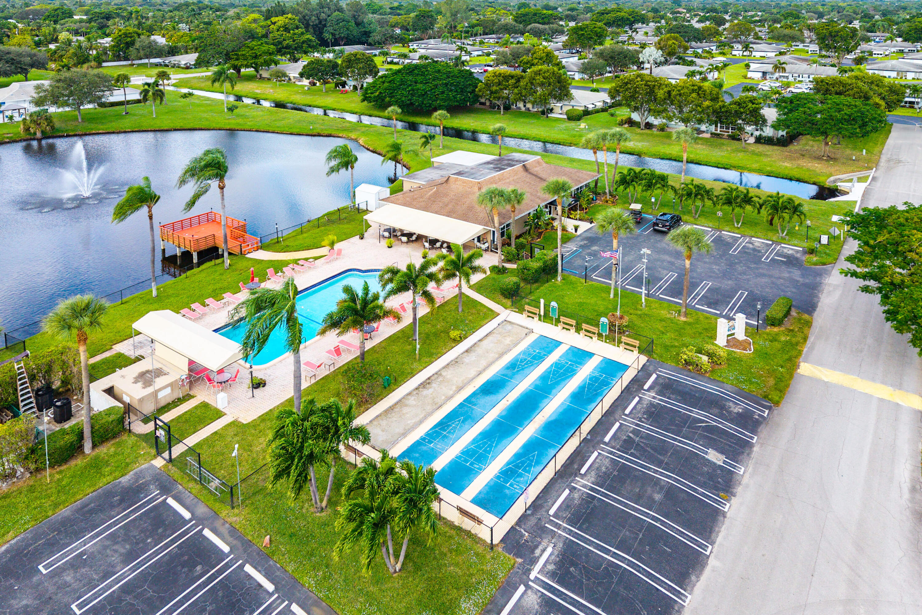 510 High Point Drive, Unit D Delray Beach, FL 33445 - Photo 22 of 23 an aerial view of a pool yard and outdoor seating