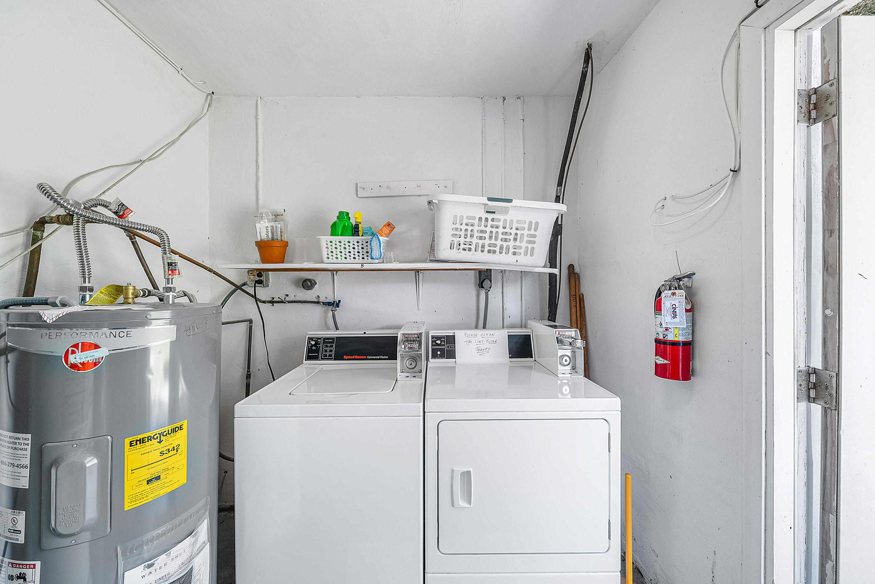 510 High Point Drive, Unit D Delray Beach, FL 33445 - Photo 23 of 23 a utility room with dryer and washer