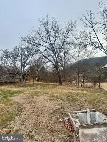 a fire hydrant in the middle of a field