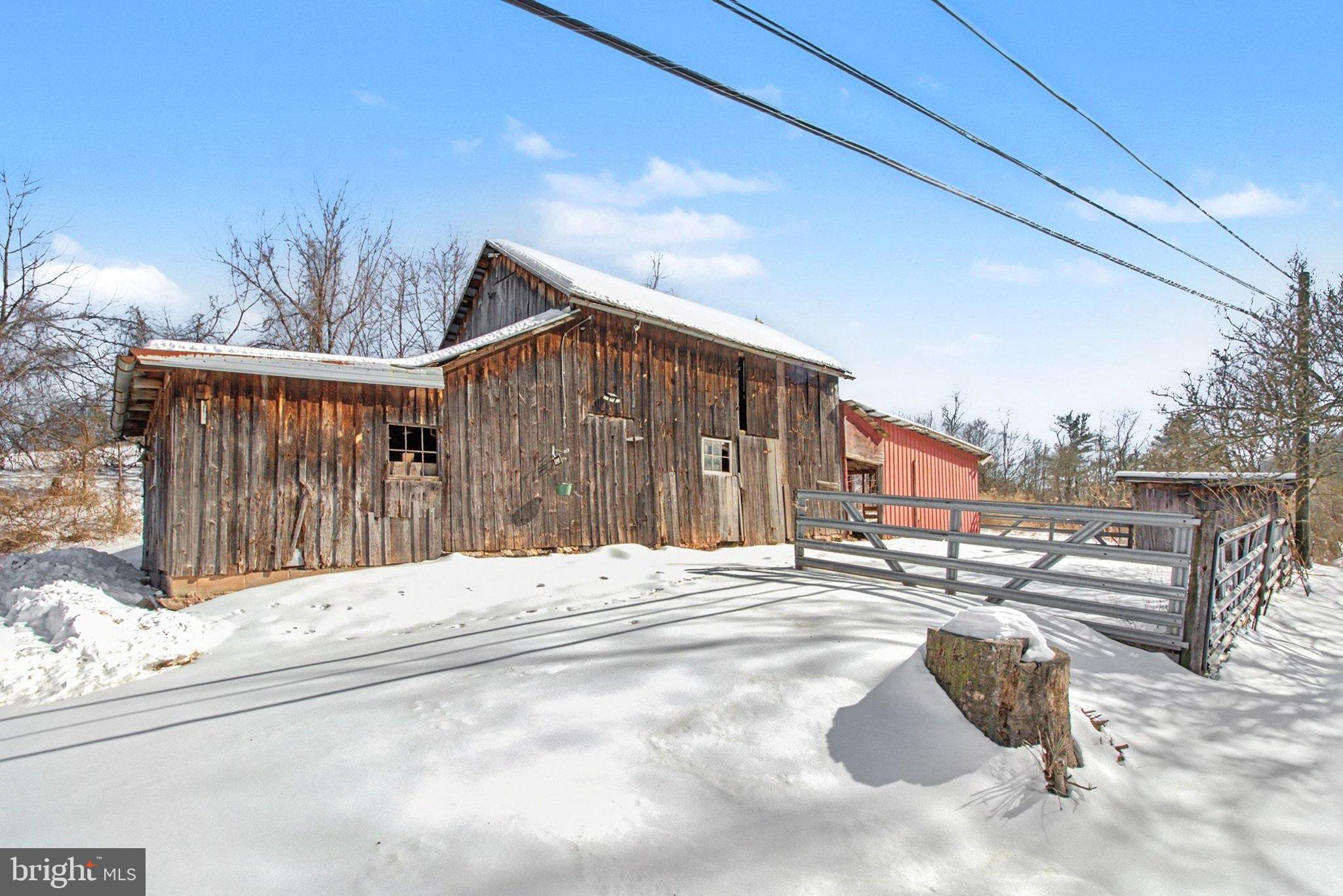 84 Kennedy Valley Road Landisburg, PA 17040 - Photo 28 of 31 Charming rustic barn in a snowy landscape.
