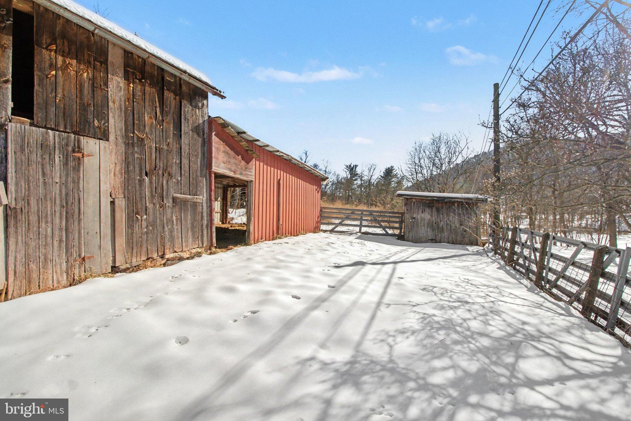 84 Kennedy Valley Road Landisburg, PA 17040 - Photo 30 of 31 Charming rustic barn in a snowy landscape.