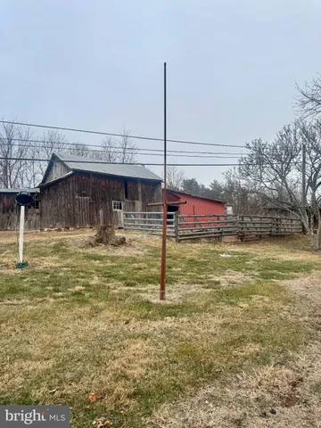a view of a swimming pool with an outdoor seating