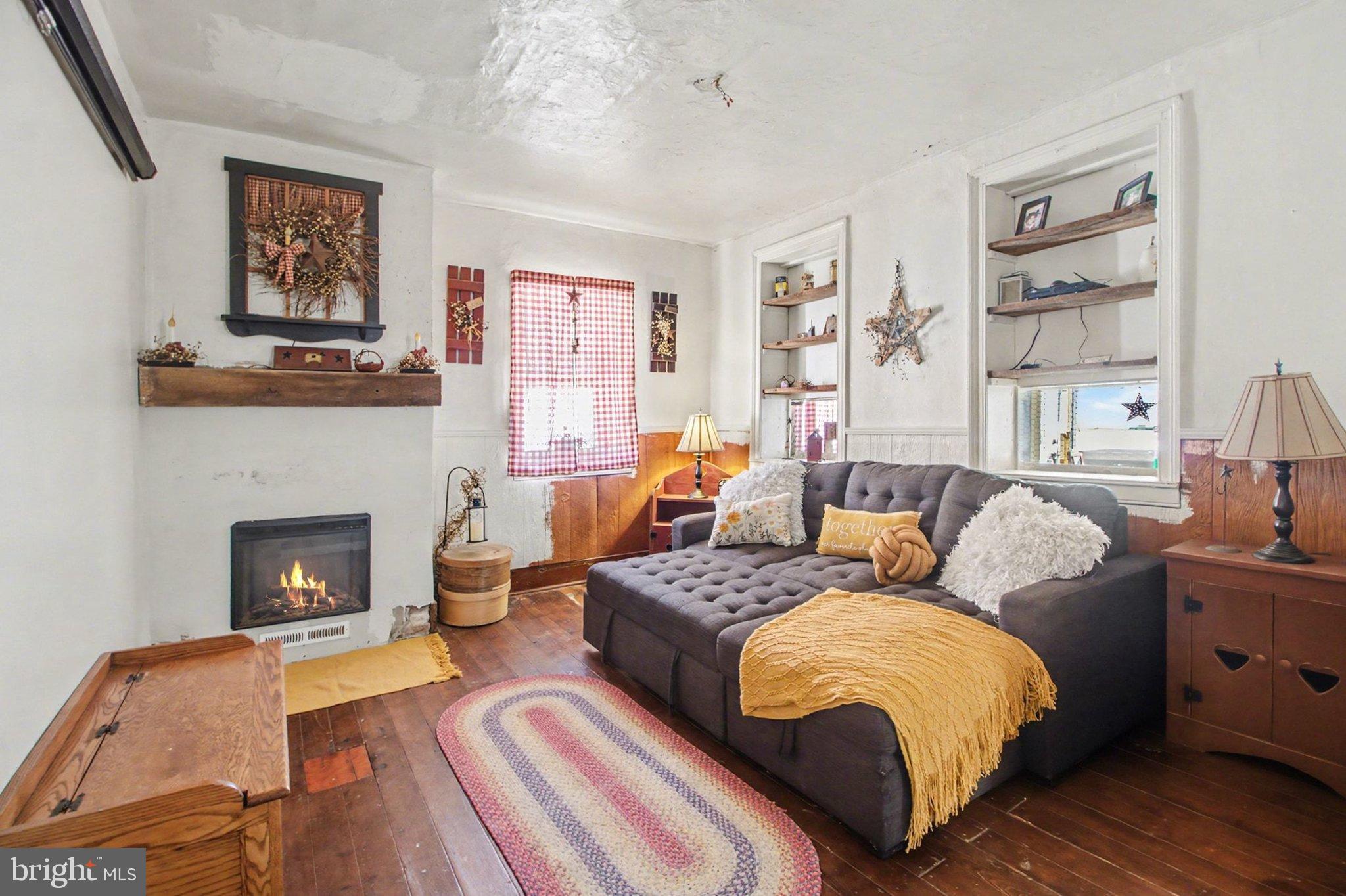84 Kennedy Valley Road Landisburg, PA 17040 - Photo 9 of 31 Cozy living space with rustic charm.