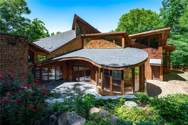 a front view of a house with garden