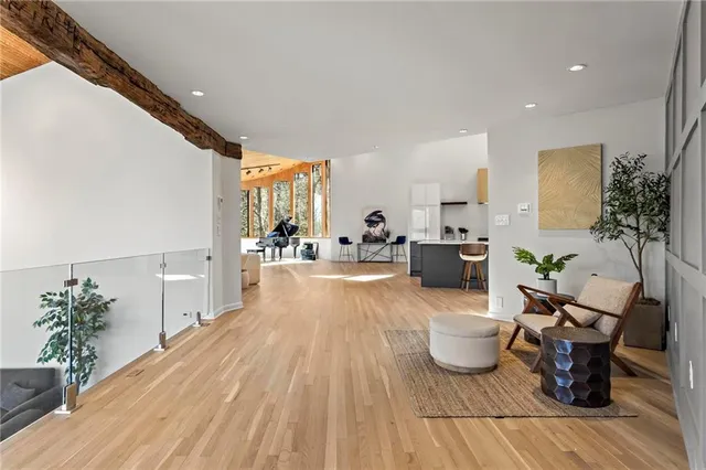 a view of a patio with table and chairs with wooden floor and fence