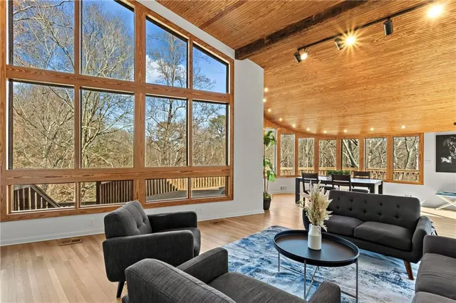 a dinning table and chairs in the patio of a house