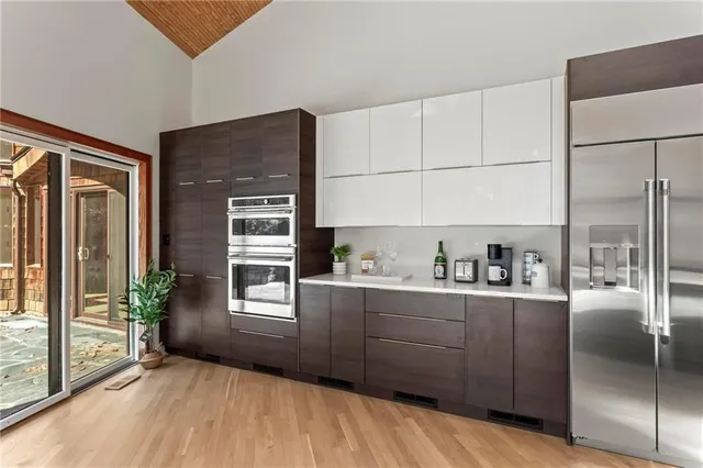 a view of a livingroom with workspace and a window