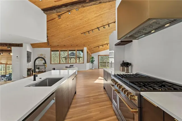 a bathroom with a sink a vanity a mirror and a shower