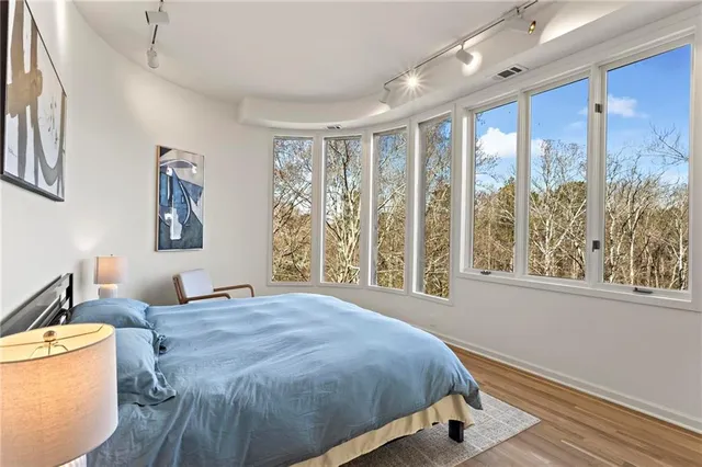 a view of a roof deck with wooden floor and fence