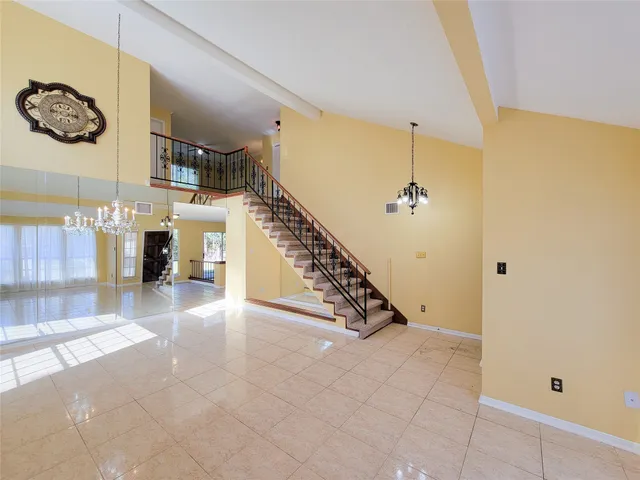 a view of an entryway and livingroom