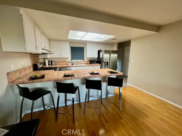a kitchen with a table and chairs in it