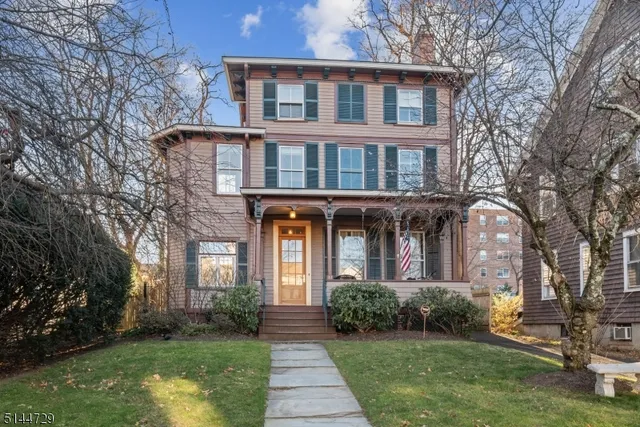 a front view of a building with garden