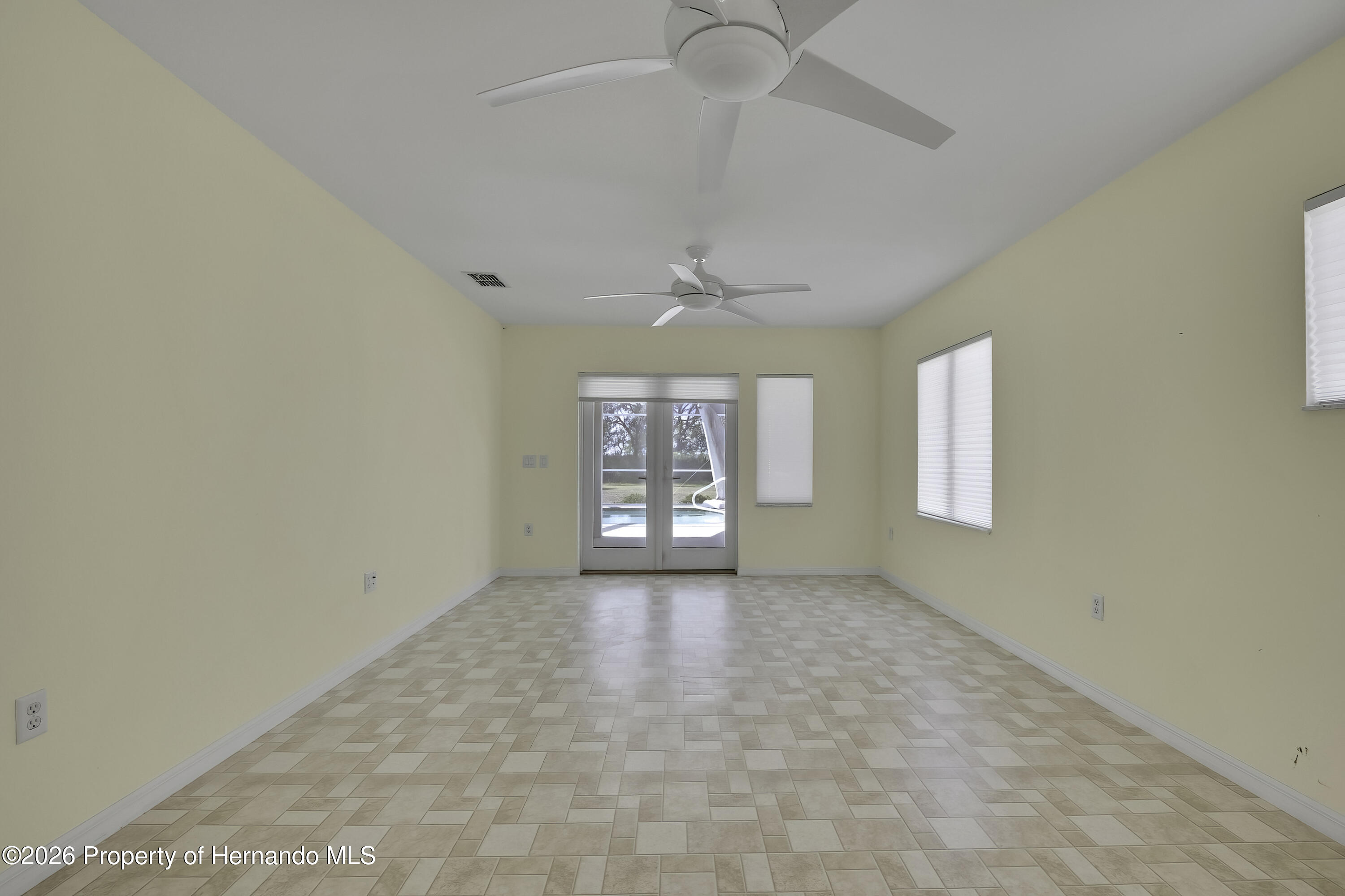 7250 Madrid Road Weeki Wachee, FL 34613 - Photo 33 of 63 French doors to pool area