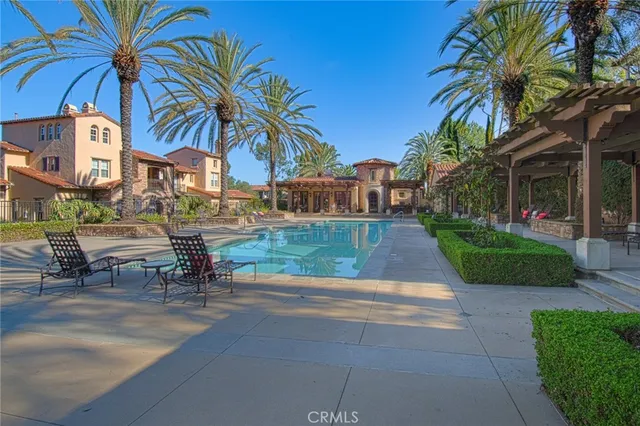a view of a chairs and table in backyard