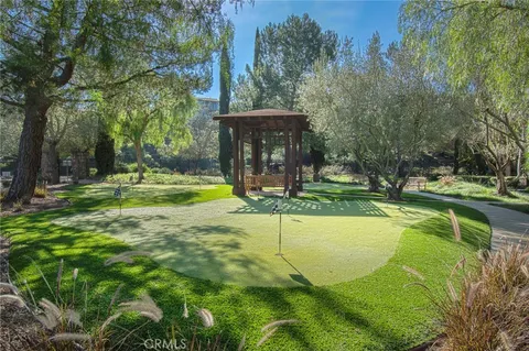 a view of a swimming pool with a yard