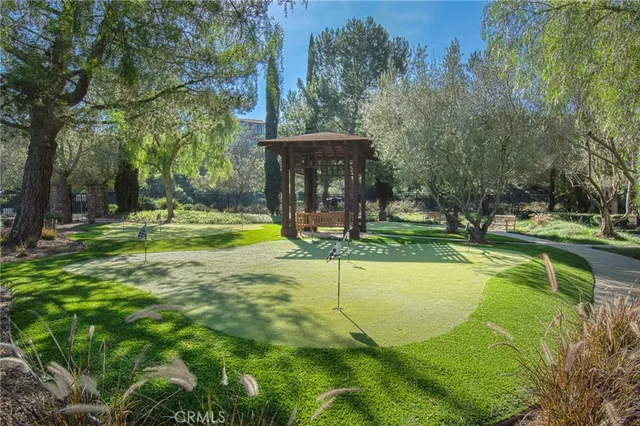 a view of a swimming pool with a yard