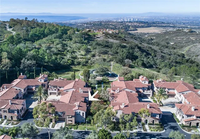 an aerial view of residential house with an outdoor space and seating