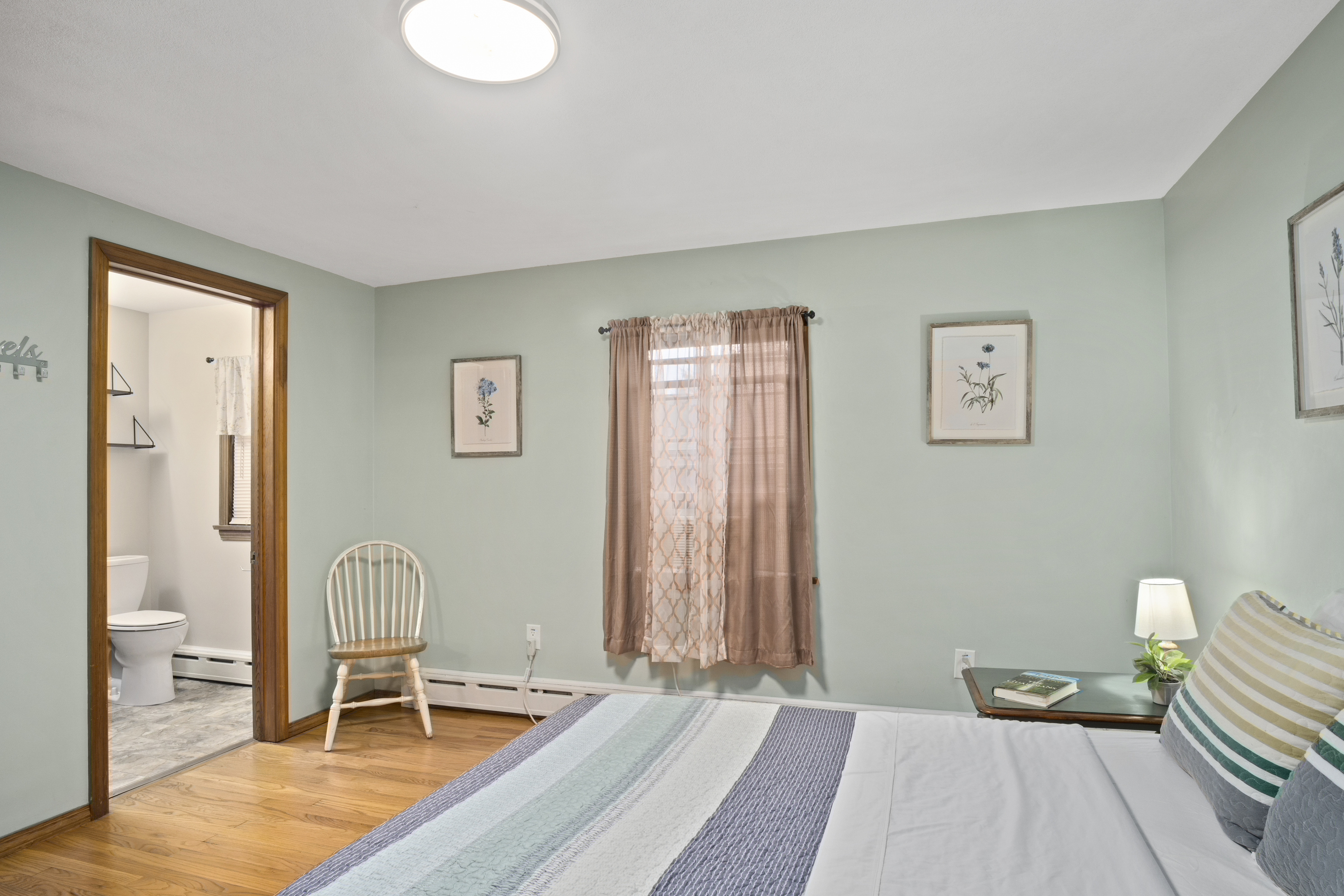 33 Briar Hill Road Norwich, CT 06360 - Photo 11 of 33 a bedroom with furniture and a wooden floor