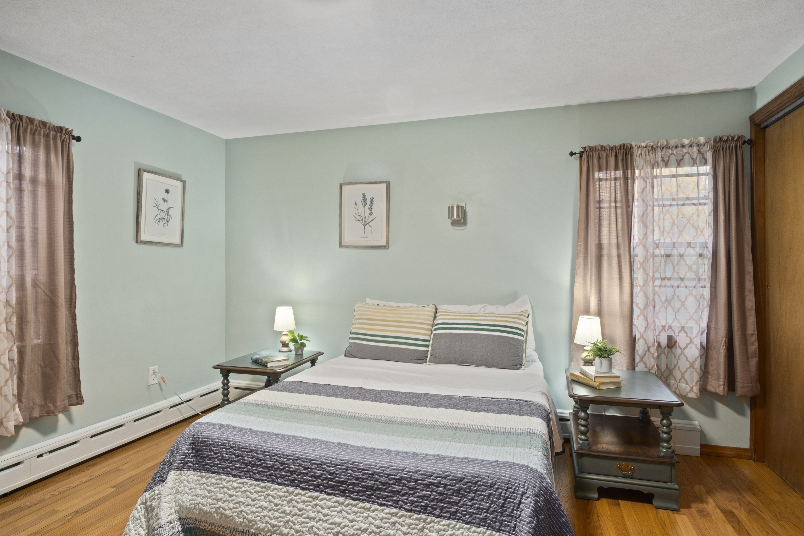 33 Briar Hill Road Norwich, CT 06360 - Photo 12 of 33 a bedroom with a bed and wooden floor