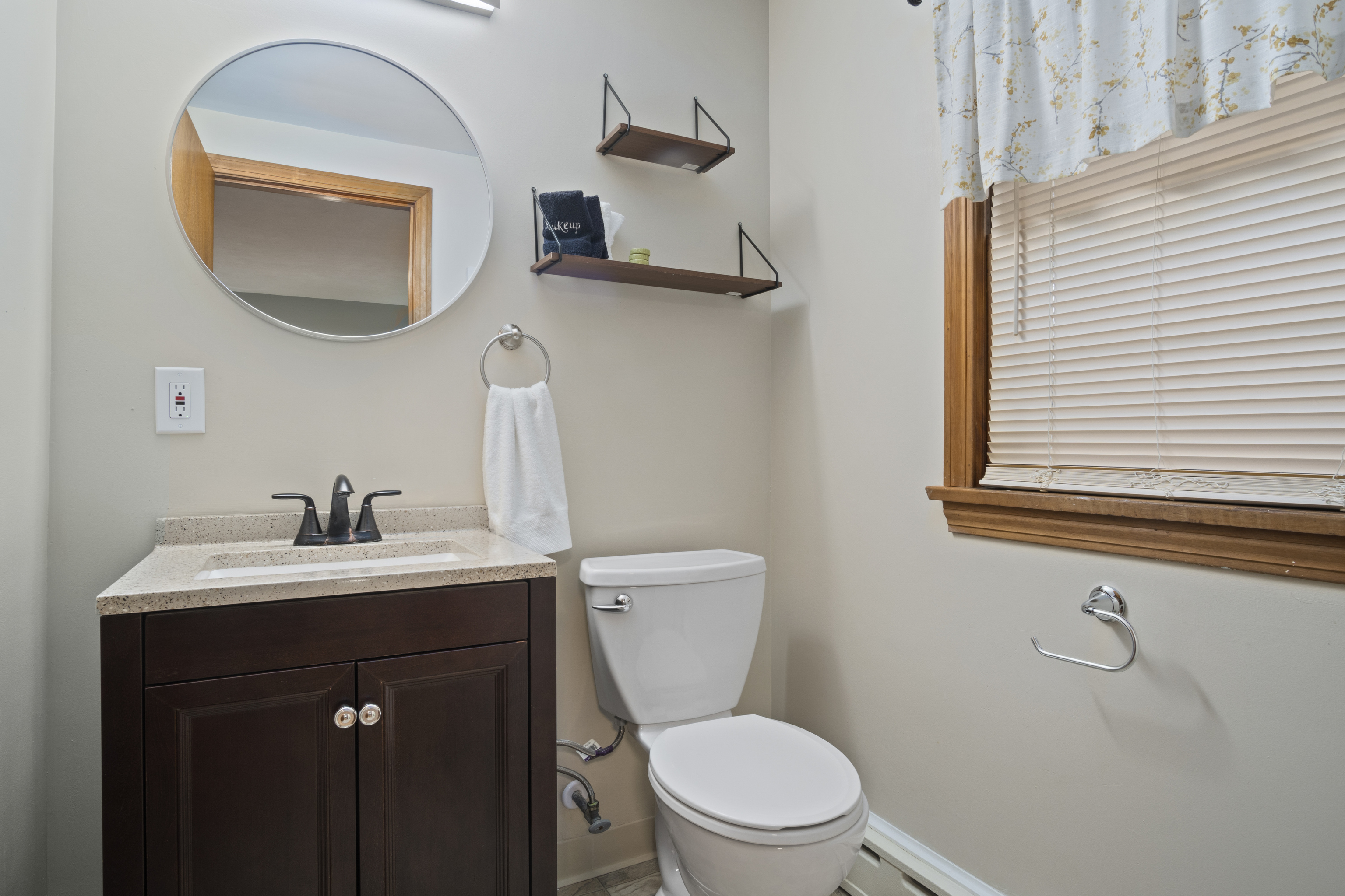 33 Briar Hill Road Norwich, CT 06360 - Photo 15 of 33 a bathroom with a toilet sink and mirror