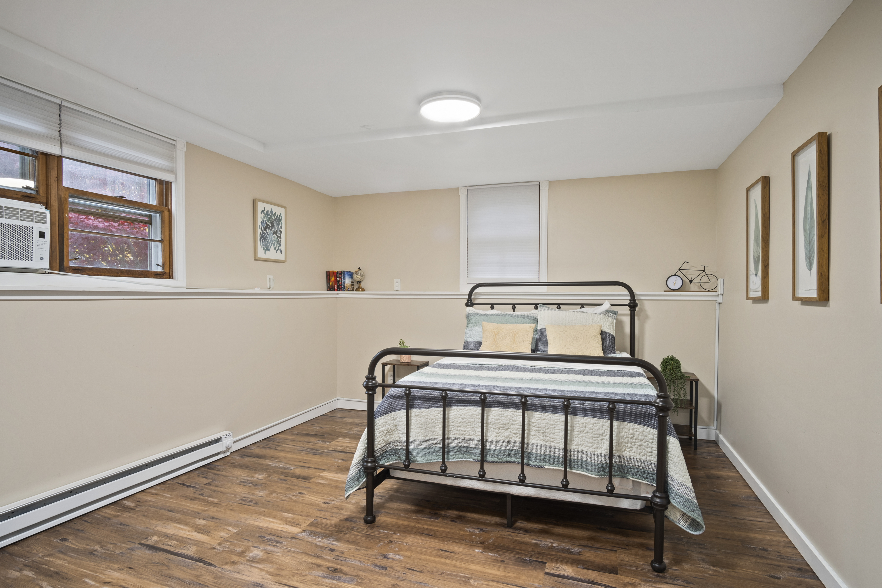 33 Briar Hill Road Norwich, CT 06360 - Photo 19 of 33 a bedroom with a bed and wooden floor