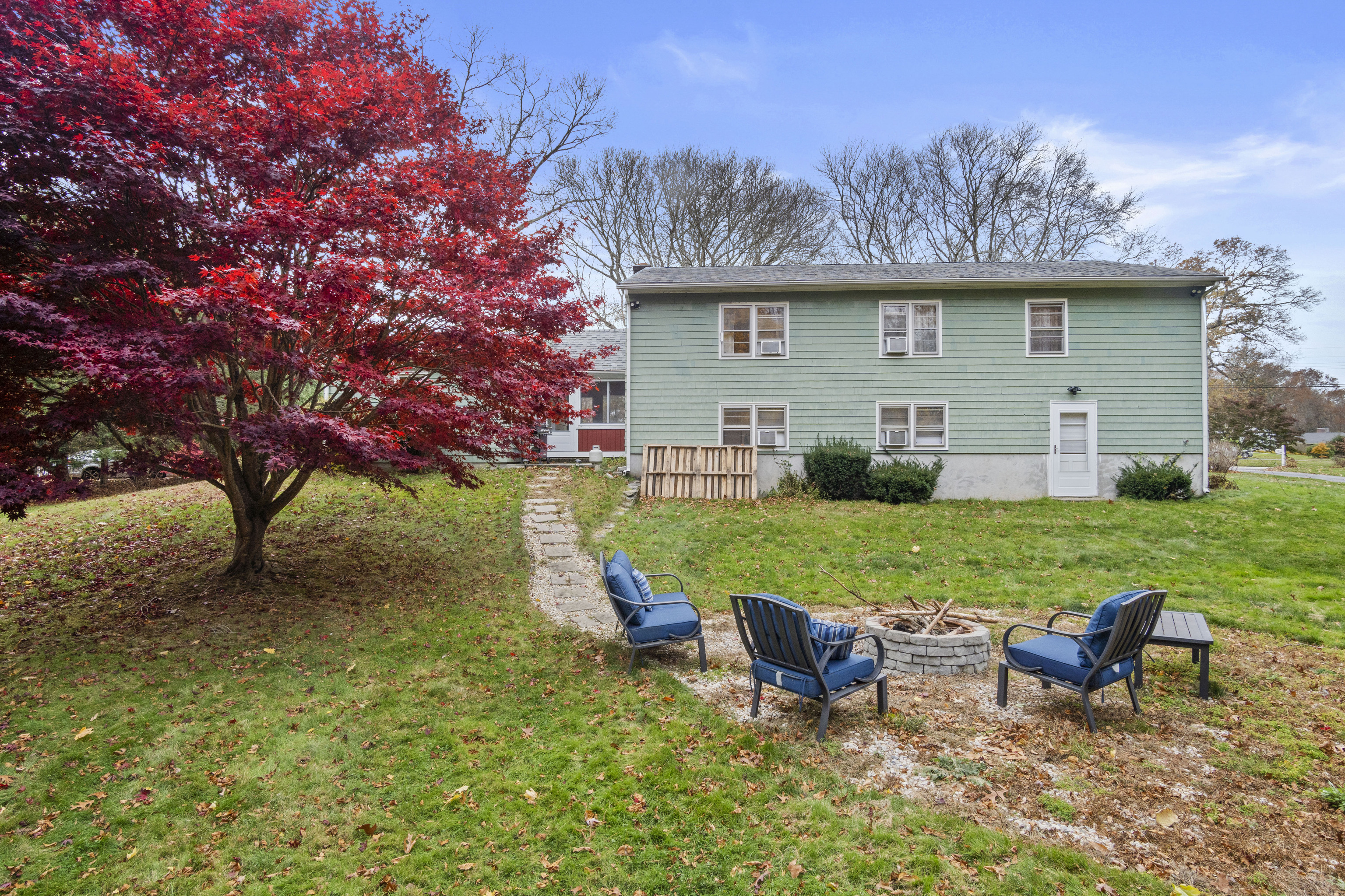 33 Briar Hill Road Norwich, CT 06360 - Photo 25 of 33 a view of a house with backyard and sitting area