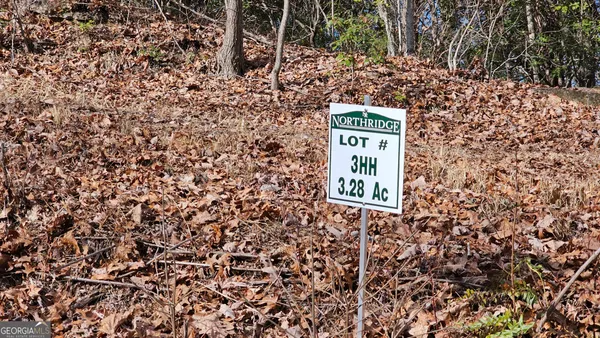 a sign that is on a brick wall