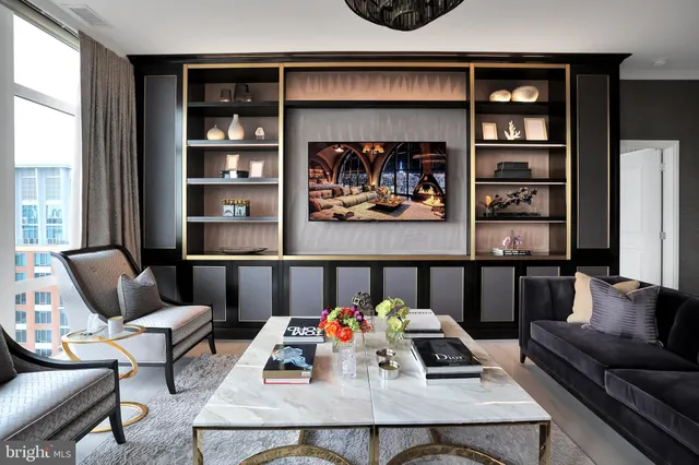 a kitchen with stainless steel appliances granite countertop a sink and a refrigerator