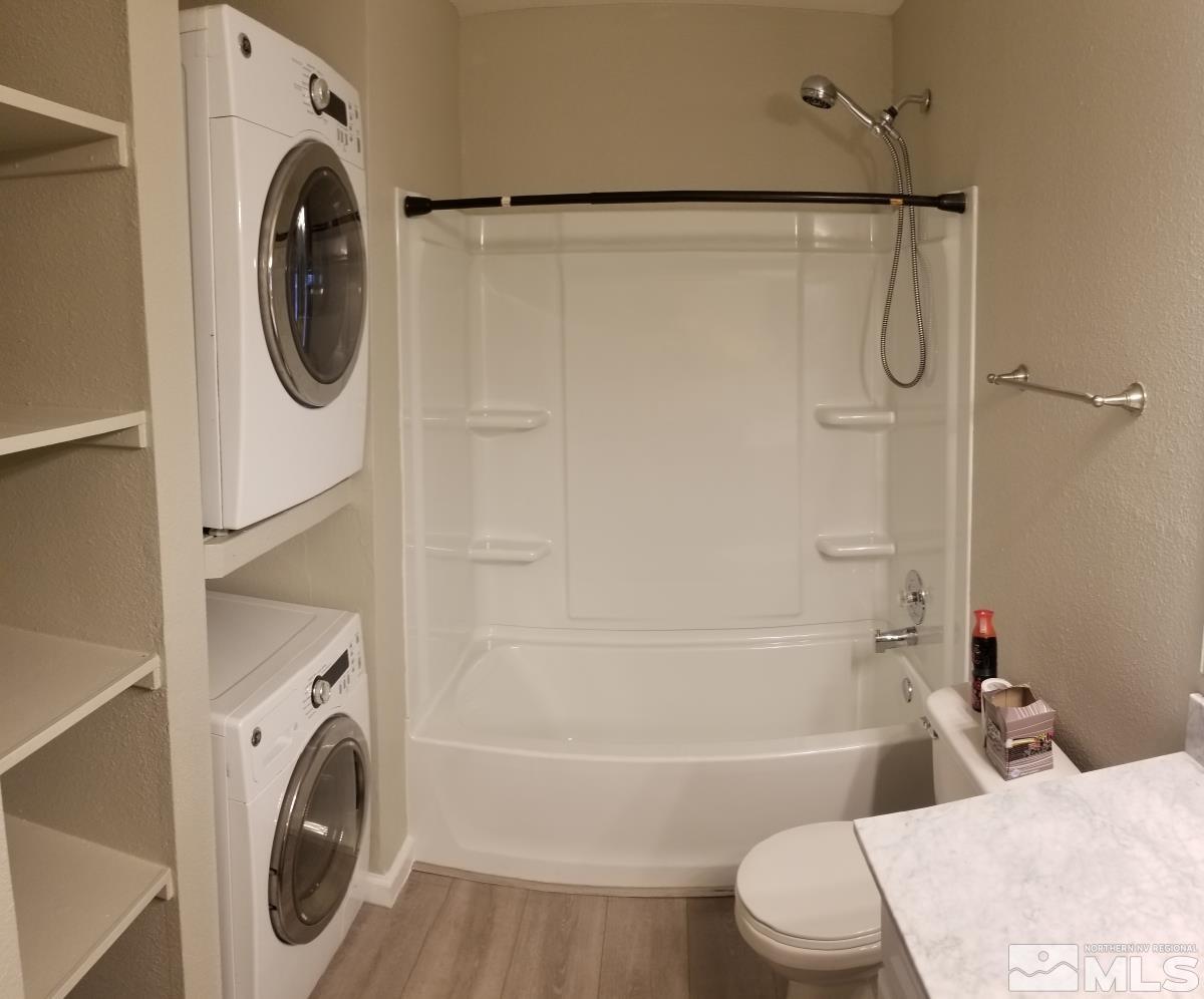 1533 Delucchi Lane Reno, NV 89502 - Photo 11 of 21 a bathroom with a sink and a washer dryer