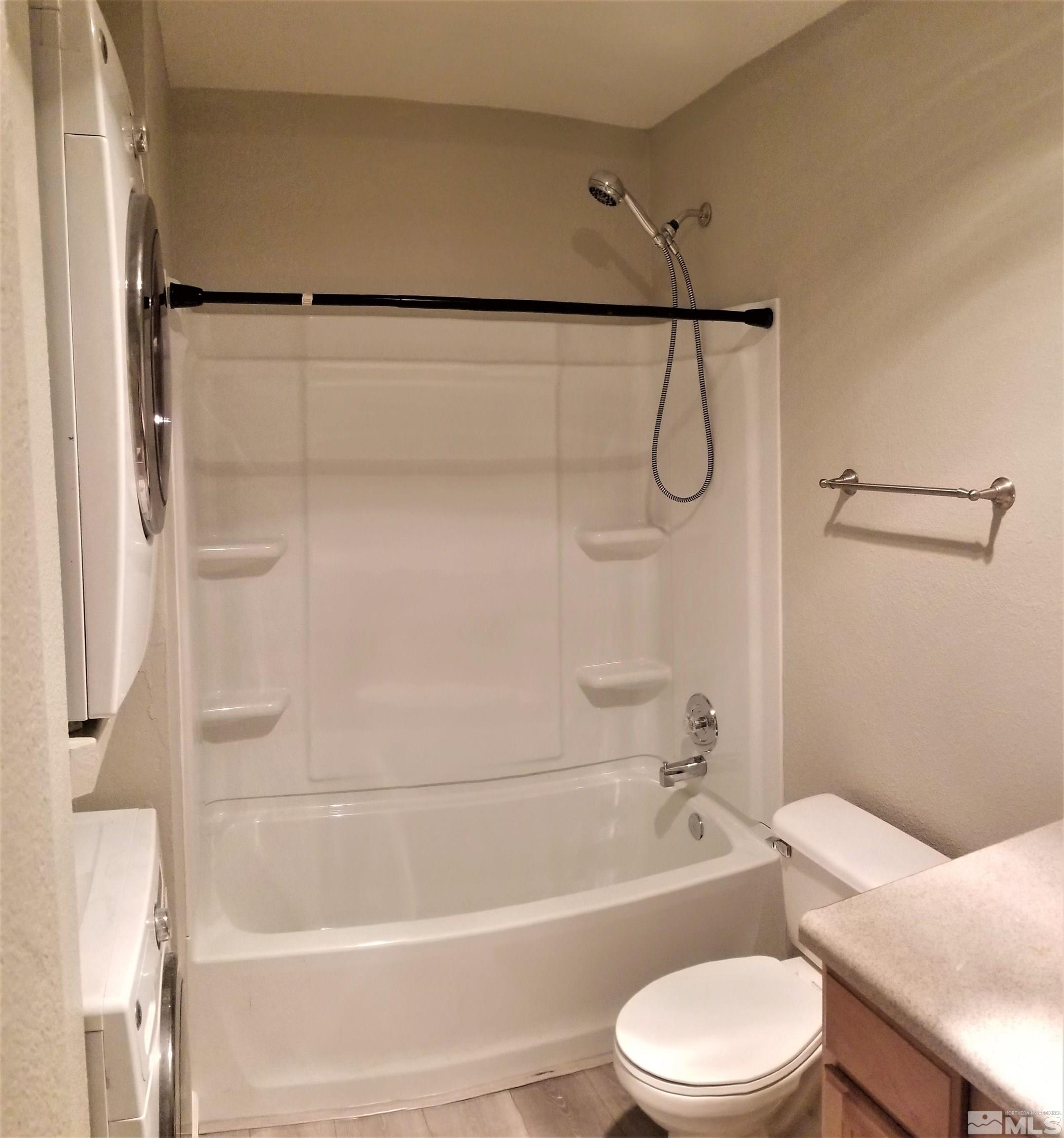 1533 Delucchi Lane Reno, NV 89502 - Photo 12 of 21 a bathroom with a toilet and a bath tub