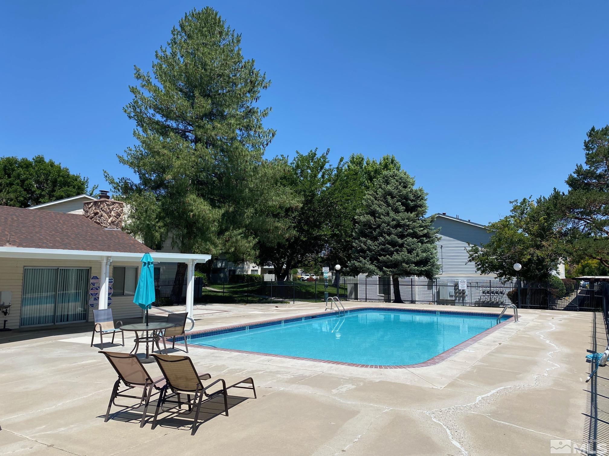 1533 Delucchi Lane Reno, NV 89502 - Photo 14 of 21 a view of a house with swimming pool and sitting area