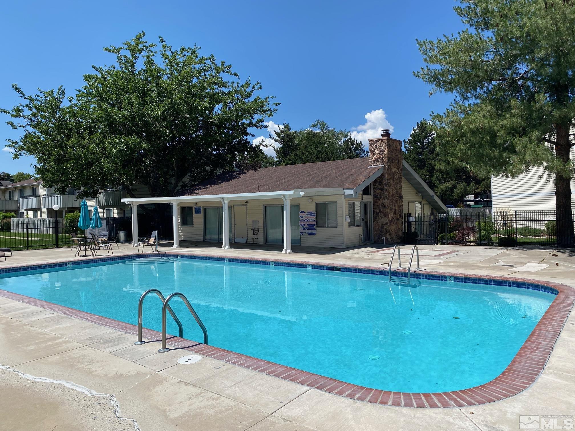 1533 Delucchi Lane Reno, NV 89502 - Photo 16 of 21 a view of a house with swimming pool