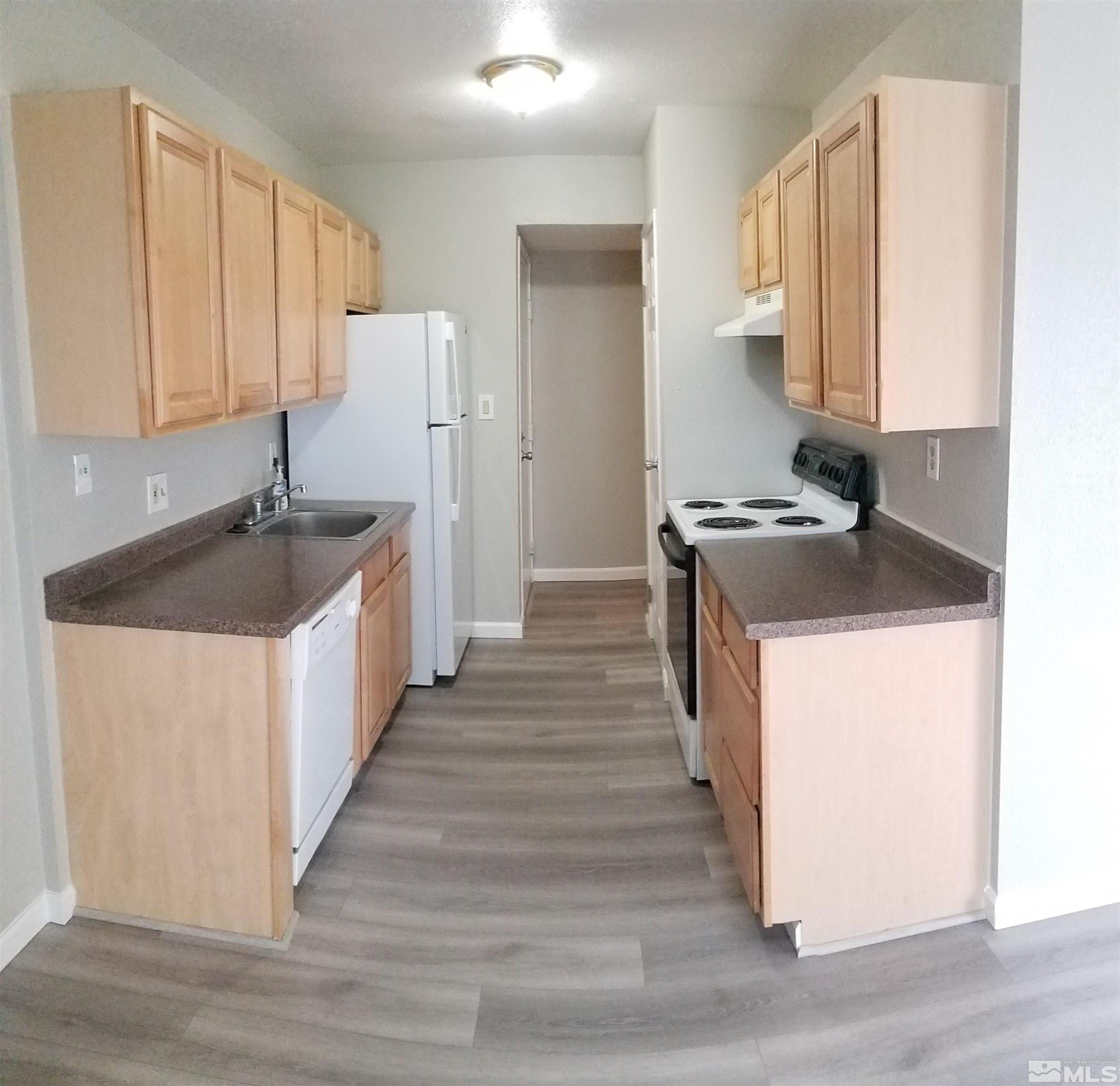 1533 Delucchi Lane Reno, NV 89502 - Photo 6 of 21 a kitchen with a sink stove and cabinets