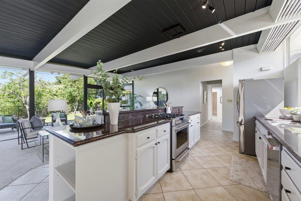 2203 Allegheny Way San Mateo, CA 94402 - Photo 7 of 56 a kitchen with a sink and stove