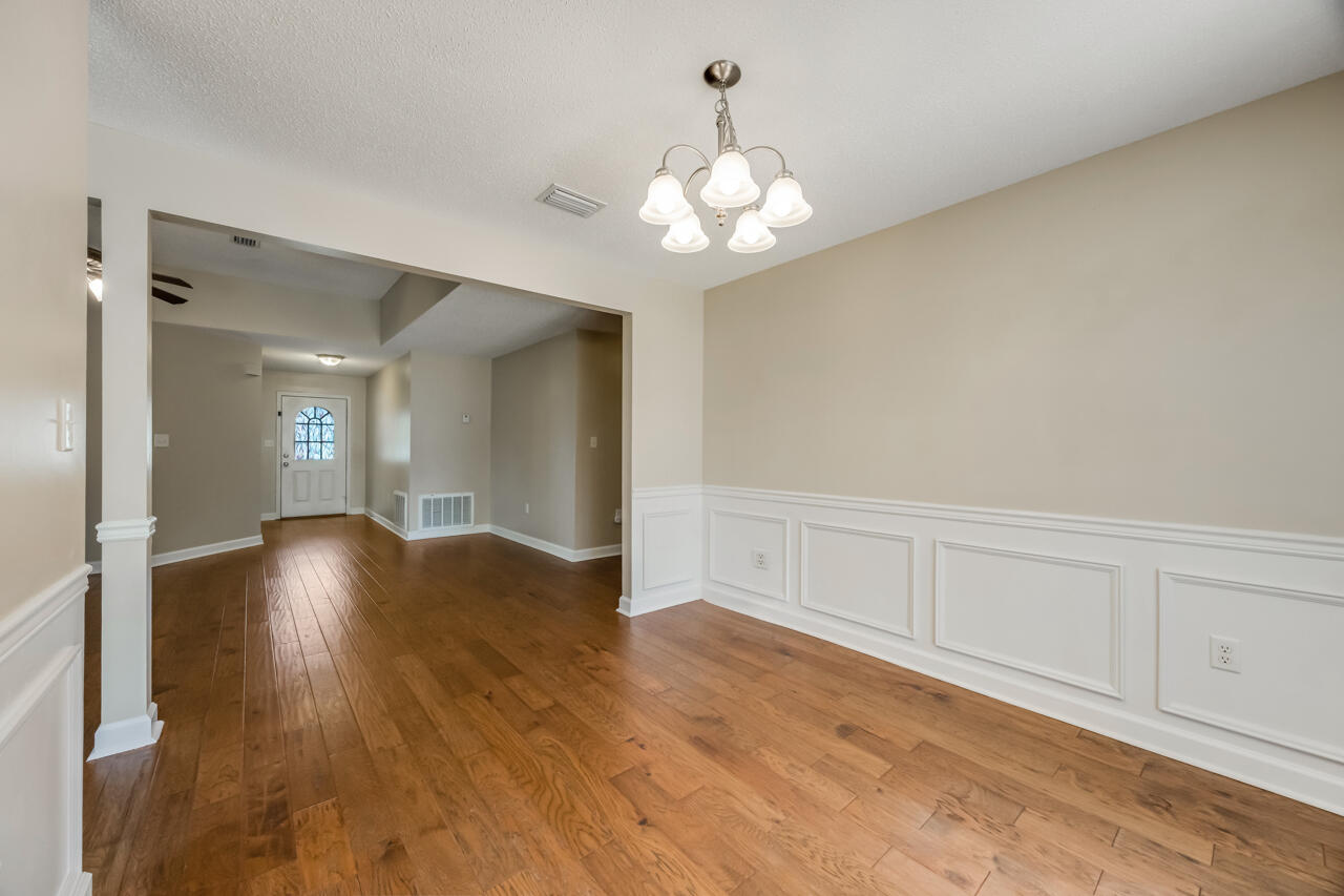 2808 Ping Lane Crestview, FL 32539 - Photo 18 of 33 a view of an empty room with wooden floor
