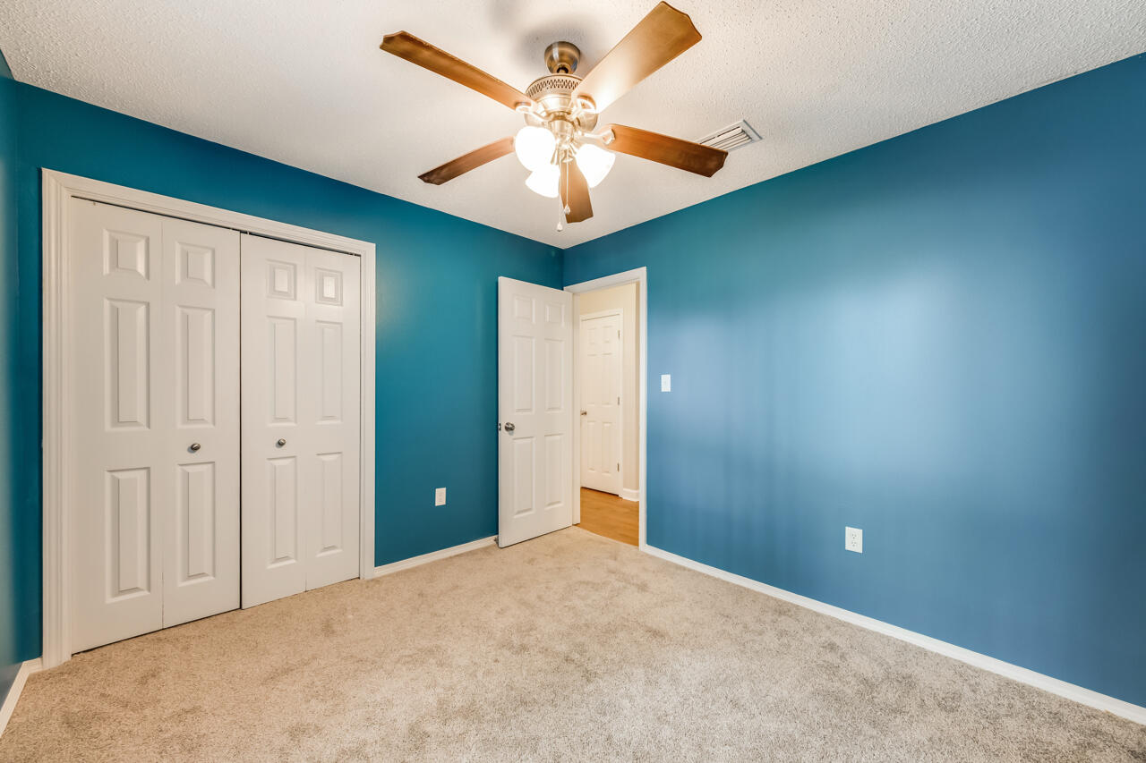 2808 Ping Lane Crestview, FL 32539 - Photo 29 of 33 an empty room with closet and a chandelier fan
