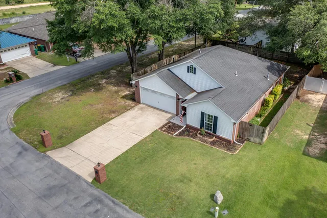 an aerial view of a house with swimming pool