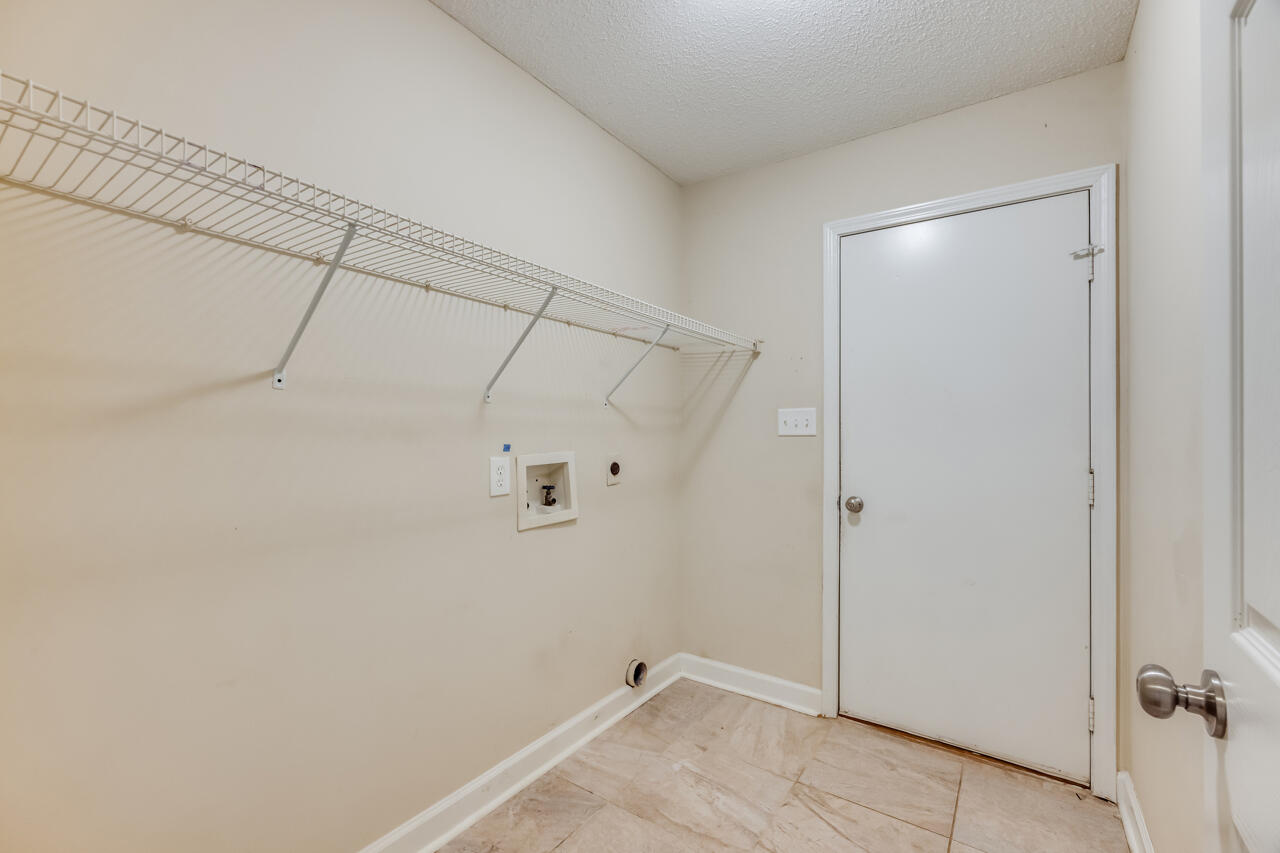 2808 Ping Lane Crestview, FL 32539 - Photo 33 of 33 a view of a room with racks on the wall