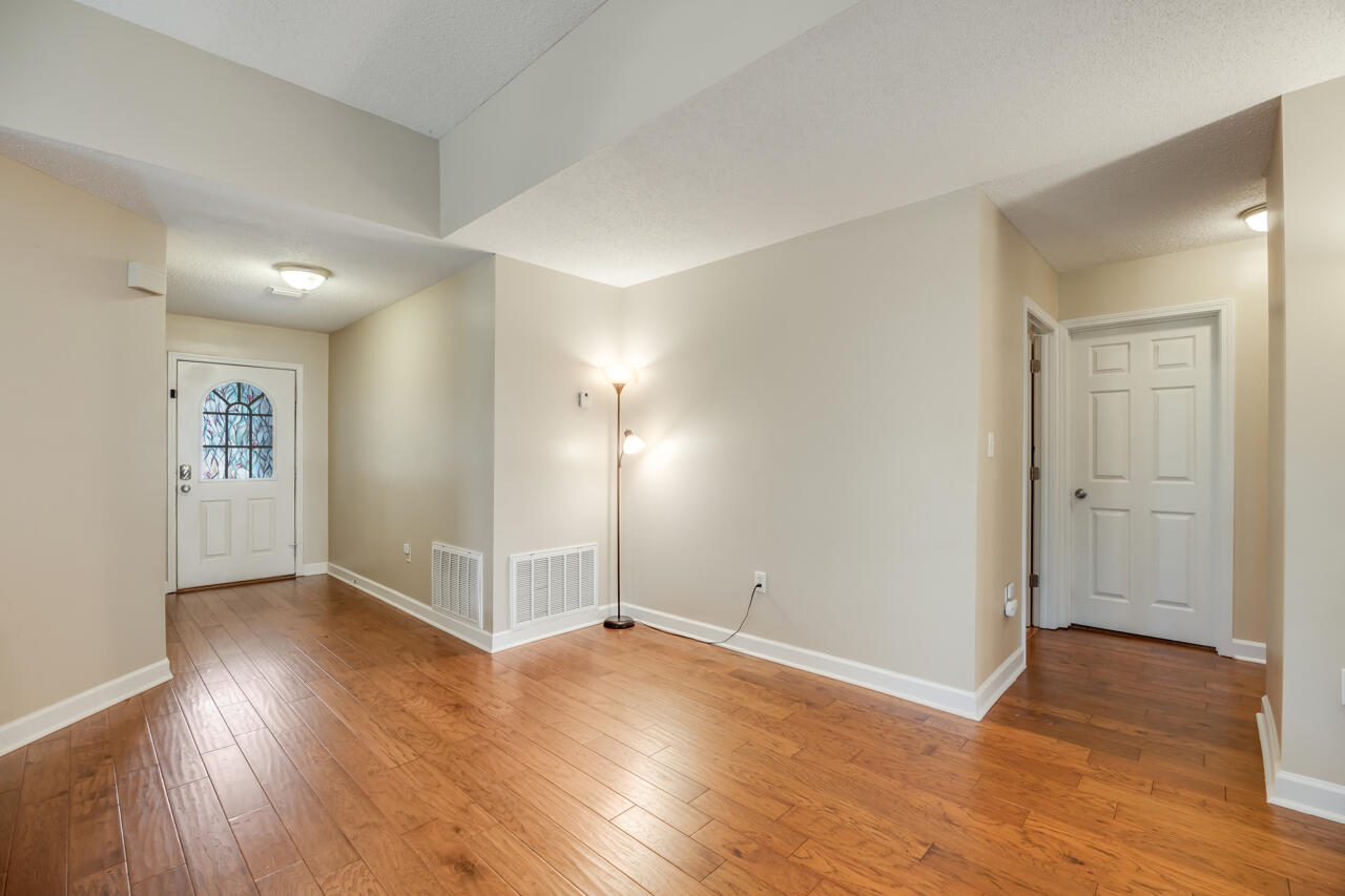 2808 Ping Lane Crestview, FL 32539 - Photo 10 of 33 an empty room with wooden floor & windows and closet