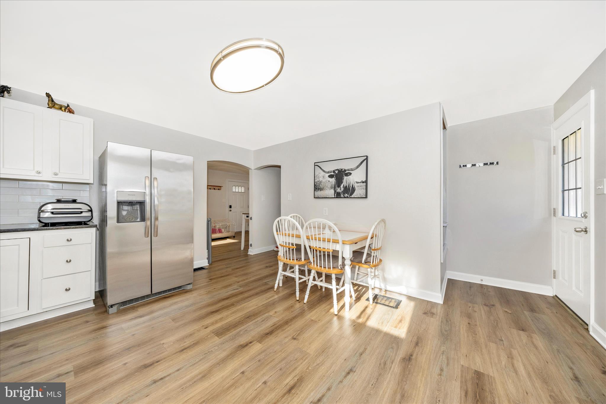 11863 Wolfsville Road Smithsburg, MD 21783 - Photo 12 of 51 a kitchen with white cabinets and stainless steel appliances